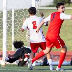Mountlake Terraces Tien Tieu and Snohomishs Thomas Pursel react to a goal scored by Snohomishs Morgan Hereth during the first half of the loser-out 3A district playoff game on Thursday, May 7, 2026 in Snohomish, Washington. (Olivia Vanni / The Herald)