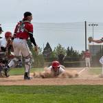 Snohomishs Breckin Davisson slides into home plate during a District 1 3A quarterfinal game against Mountlake Terrace on Saturday, May 9, 2026 at Snohomish H.S. (Qasim Ali / The Herald)