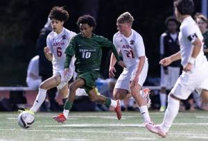 Edmonds-Woodways Natan Ghebreamlak dribbles the ball during a March 31, 2026 match in Edmonds, Washington. (Olivia Vanni / The Herald)