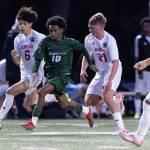 Edmonds-Woodways Natan Ghebreamlak dribbles the ball during a March 31 match in Edmonds, Washington. (Olivia Vanni / The Herald)