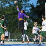 Edmonds-Woodways Isaiah Zabel blocks a shot during the 3A district semifinal game against Shorecrest on Tuesday, May 12, 2026 in Shoreline, Washington. (Olivia Vanni / The Herald)