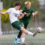 Edmonds-Woodways Campbell Turcott crosses the ball while under pressure from Shorecrests Cole Ambrose during the 3A district semifinal game on Tuesday, May 12, 2026 in Shoreline, Washington. (Olivia Vanni / The Herald)