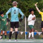 Edmonds-Woodways Neaphtali Daniel reacts to getting a yellow card during the 3A district semifinal game against Shorecrest on Tuesday, May 12, 2026 in Shoreline, Washington. (Olivia Vanni / The Herald)