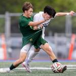 Edmonds-Woodways Jackson Cho grabs the uniform of Shorecrests Drew Mathieson as they battle for the ball during the 3A district semifinal game on Tuesday, May 12, 2026 in Shoreline, Washington. (Olivia Vanni / The Herald)