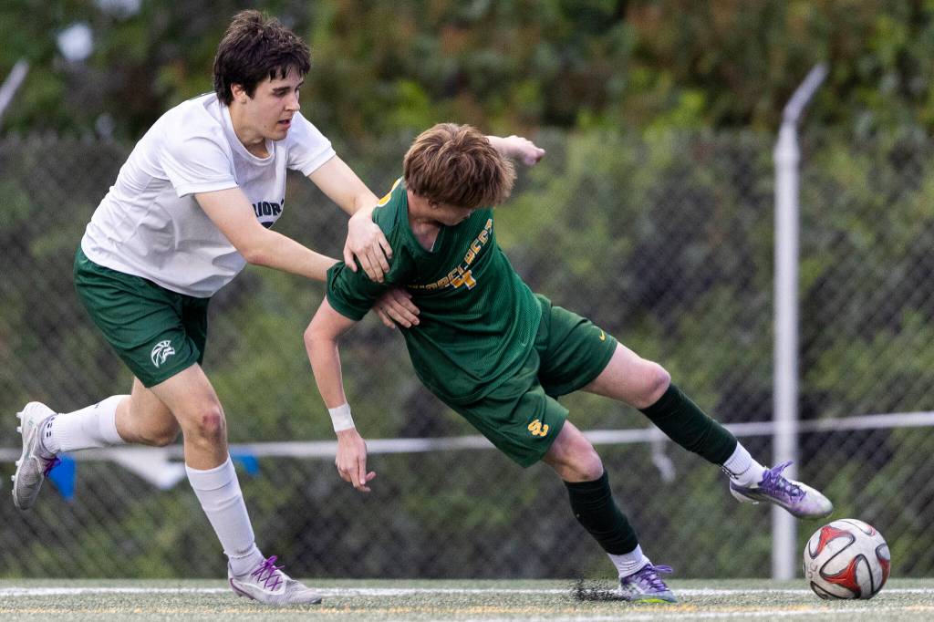 Shorecrests Kai Short (9) controls the ball against Edmonds-Woodways Ryan Farrell during the 3A district semifinal game on Tuesday, May 12, 2026 in Shoreline, Washington. (Olivia Vanni / The Herald)