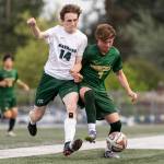 Edmonds-Woodways Will Bourbonnais and Shorecrests Kai Short battle for the ball during the 3A district semifinal game on Tuesday, May 12, 2026 in Shoreline, Washington. (Olivia Vanni / The Herald)