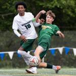 Shorecrests Drew Mathieson crosses the ball while under pressure from Edmonds-Woodways Natan Ghebreamlak during the 3A district semifinal game on Tuesday, May 12, 2026 in Shoreline, Washington. (Olivia Vanni / The Herald)