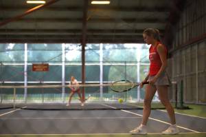 Stanwoods Addison Bowie prepares to serve during the District 1 3A doubles title match against Snohomish on Wednesday, May 13, 2026 at Skagit Valley College in Mount Vernon. (Qasim Ali / The Herald)