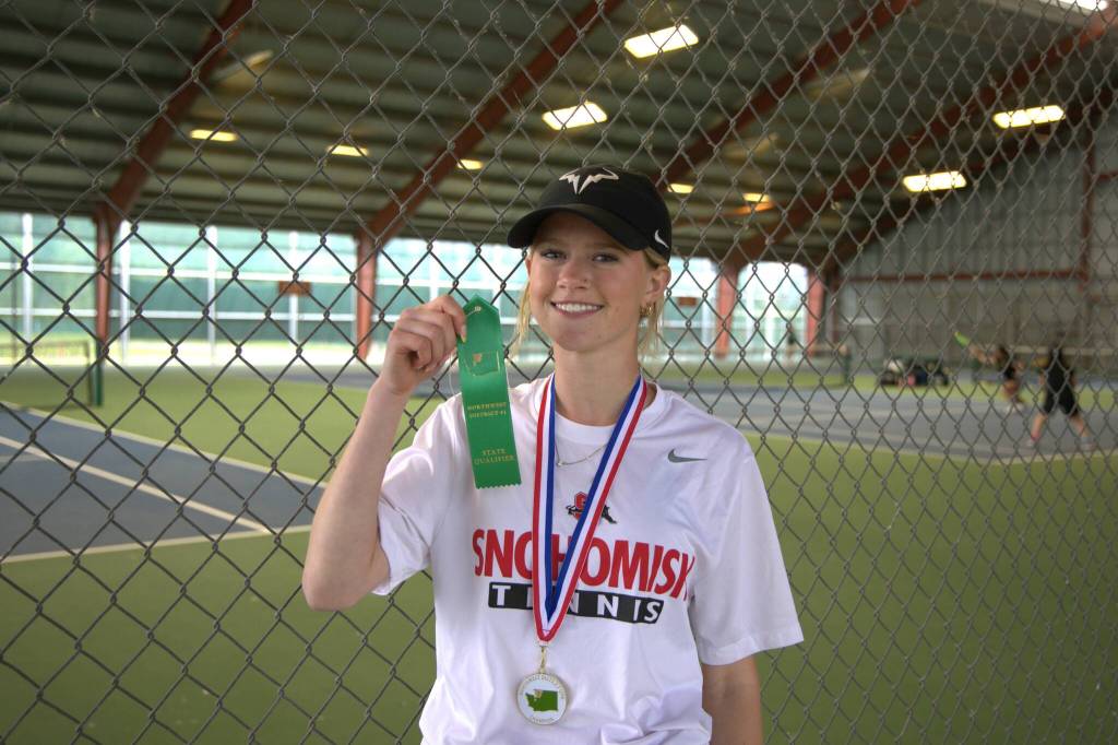 Snohomishs Mak Dauer poses with her medal and ribbon after winning the District 1 3A singles title on Wednesday, May 13, 2026 at Skagit Valley College in Mount Vernon. (Qasim Ali / The Herald)