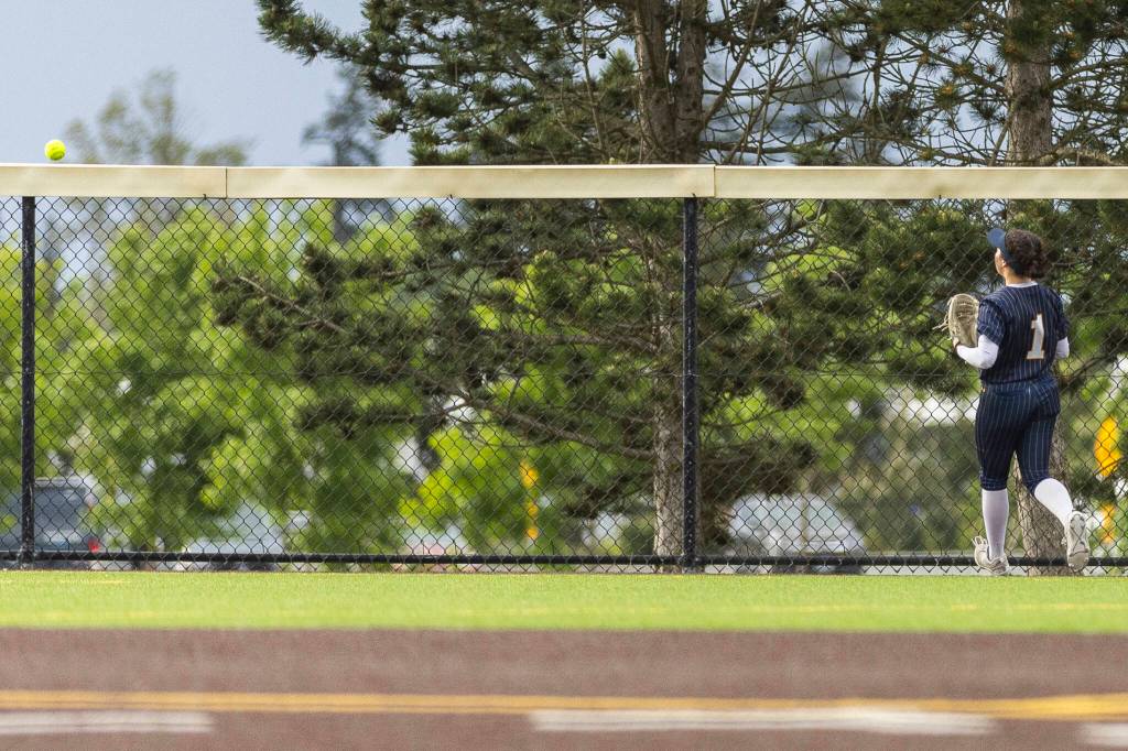 Everetts Emma Hoffman watches a home run go over the back fence during the 3A district championship game against Sedro-Woolley on Thursday, May 14, 2026 in Everett, Washington. (Olivia Vanni / The Herald)