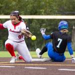 Shorewoods Alyssa Carver slides safely into second base as the ball misses the glove of Snohomishs Amelie Lopez during the 3A district loser-out game on Thursday, May 14, 2026 in Everett, Washington. (Olivia Vanni / The Herald)