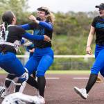 Shorewoods Ellie Van Horn runs to hug teammates Shorewoods Lillian Perreault after beating Snohomish in the 3A district loser-out game on Thursday, May 14, 2026 in Everett, Washington. (Olivia Vanni / The Herald)