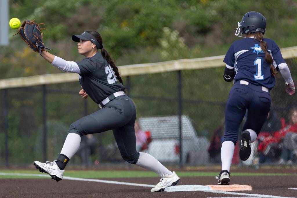 Meadowdales Arianna Lyon beats the throw to first base during the 3A district loser-out game against Stanwood on Thursday, May 14, 2026 in Everett, Washington. (Olivia Vanni / The Herald)