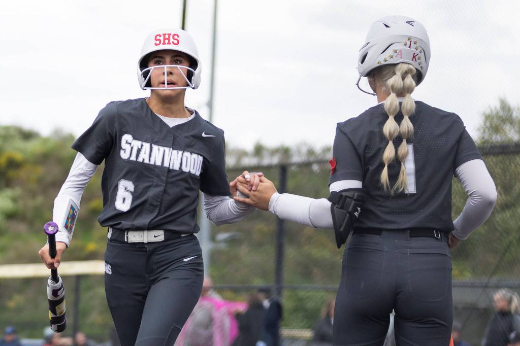 Stanwoods Jemma Lopezhigh fives teammate Aaliyah Shafer after scoring on Thursday, May 14, 2026 in Everett, Washington. (Olivia Vanni / The Herald)