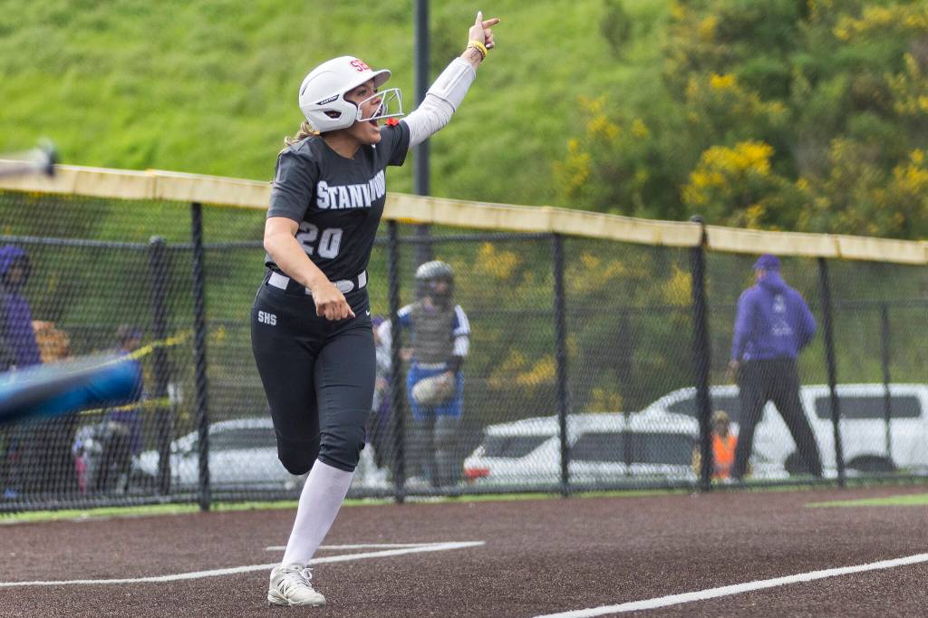 Stanwoods Addi Anderson reacts to the home run hit by Stanwoods Jordan Rancourt during the 3A district loser-out game against Meadowdale on Thursday, May 14, 2026 in Everett, Washington. (Olivia Vanni / The Herald)