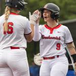 Snohomishs Abby Edwards high fives teammates Snohomishs Rhys Doyle during the 3A district loser-out game against Shorewood on Thursday, May 14, 2026 in Everett, Washington. (Olivia Vanni / The Herald)