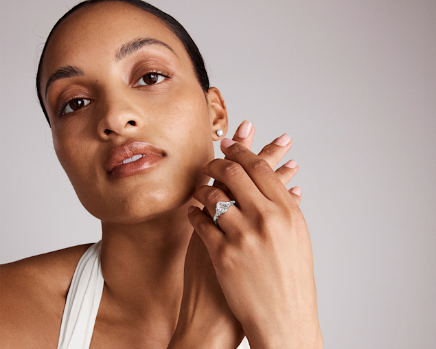 bride wearing pear cut solitaire engagement ring