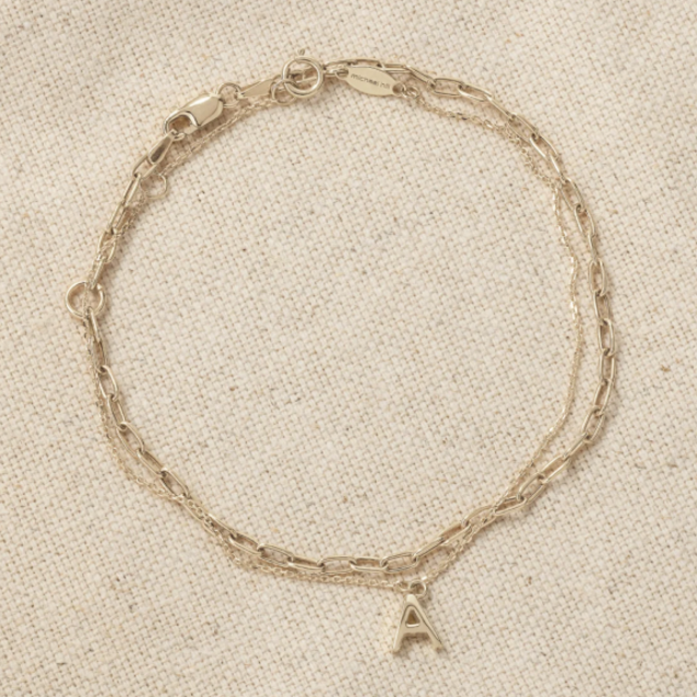 yellow gold bracelets flat lay