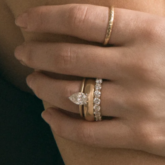 gold pear cut engagement ring with diamond eternity and plain wedding band